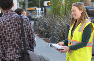 An SFMTA volunteer polling pedestrians. Links to Evaluating & Monitoring Our Progress page.