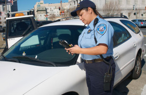 Trafficer Officer issuing a parking ticket.